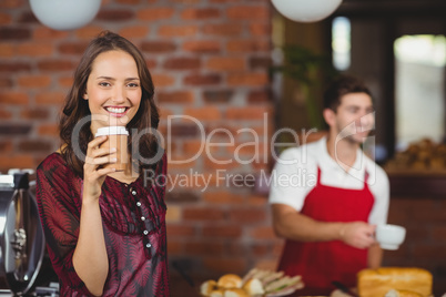 A pretty woman drinking a coffee