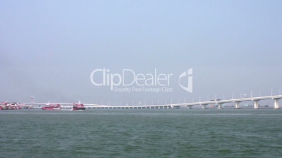 Jetfoils arriving and leaving Macau with view of Friendship bridge