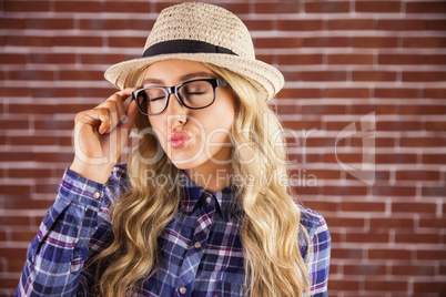Gorgeous blonde hipster sending air kiss