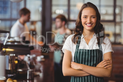 Pretty barista with arms crossed