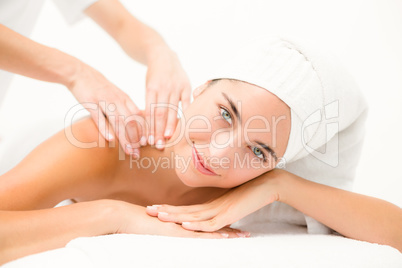Attractive young woman receiving shoulder massage