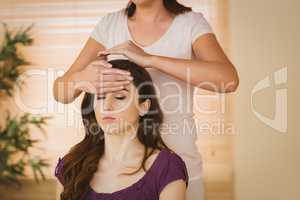 Young woman having a reiki treatment