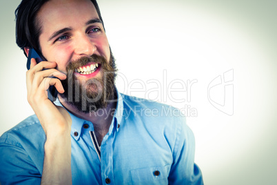 Handsome hipster making a call