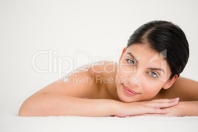 Woman lying with salt scrub on the back