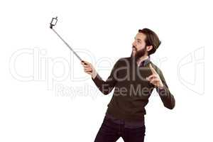 Hipster using his seflie stick
