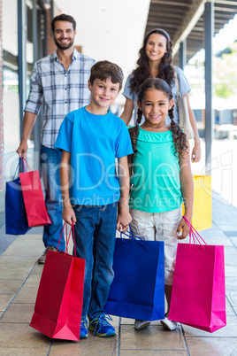 Happy family having fun in the mall