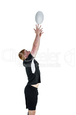 Rugby player catching a rugby ball