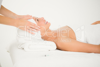 Attractive woman receiving facial massage