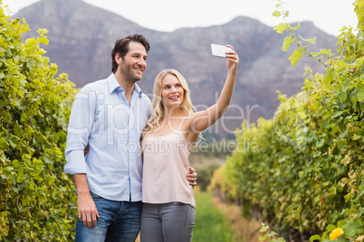 Young happy couple taking a selfie