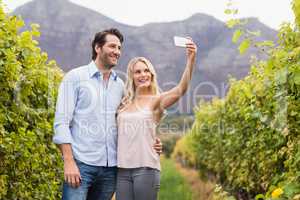 Young happy couple taking a selfie