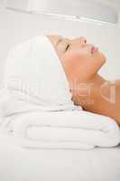 Woman lying on massage table at spa