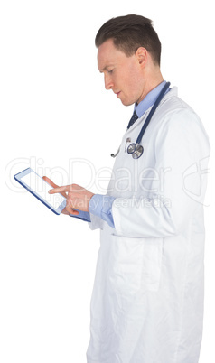 Doctor scrolling on a digital tablet