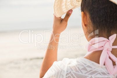 Stylish girl looking to the sea