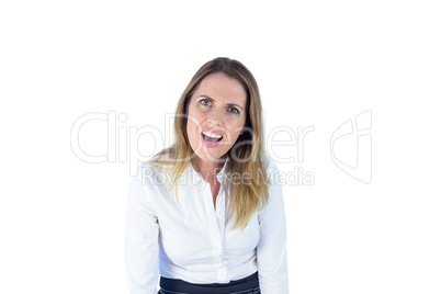 Astonished businesswoman looking at the camera