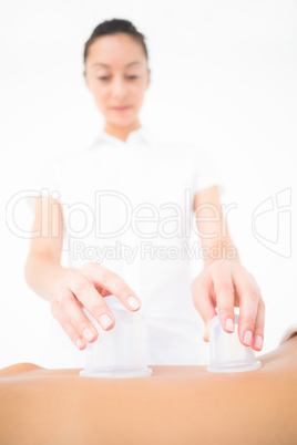 Therapist making a suction massage