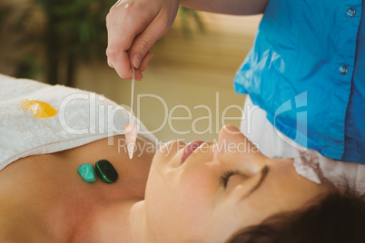 Young woman at crystal healing session
