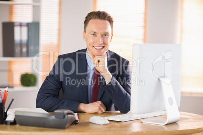 Stylish businessman smiling at camera