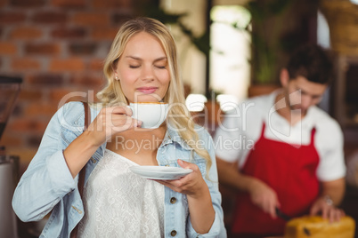 Pretty woman enjoying a cup of coffee