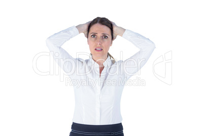 Stressed businesswoman with hands on her head