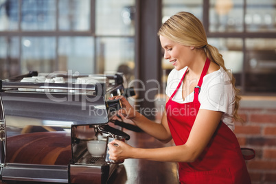 A pretty barista preparing coffee