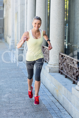 A beautiful woman running in the street
