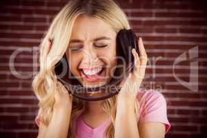 Portrait of a beautiful woman singing with headphones