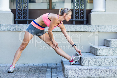 A beautiful woman stretching her leg