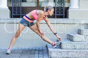 A beautiful woman stretching her leg