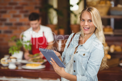 Pretty woman using her tablet