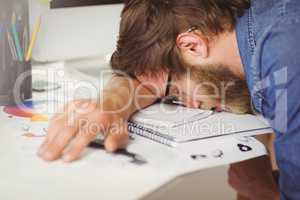 Hipster businessman sleeping at his desk