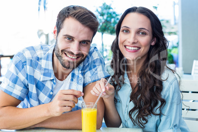 Cute couple sitting in cafe