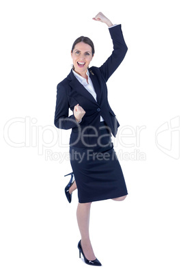 Pretty businesswoman doing a victory pose