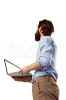Handsome hipster holding a laptop