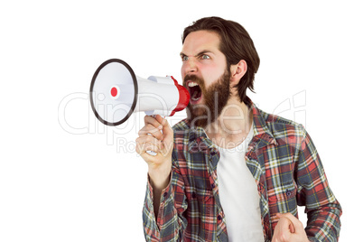 Handsome hipster shouting through megaphone