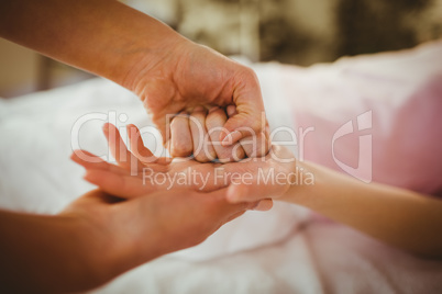 Young woman getting hand massage