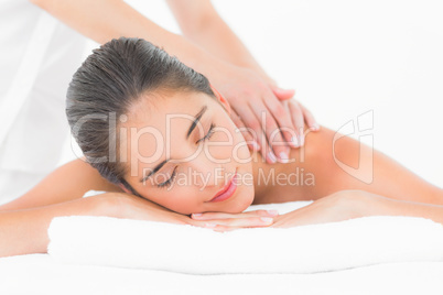 Attractive woman receiving shoulder massage at spa center Attractive woman receiving shoulder massage at spa center