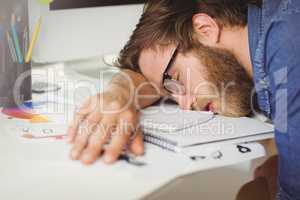 Hipster businessman sleeping at his desk