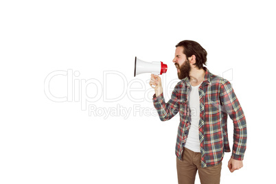 Handsome hipster shouting through megaphone