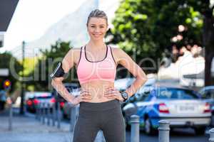 Portrait of a beautiful athlete with her hands on her hips