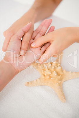 A woman having a hand massage