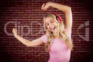 Beautiful woman dancing with headphones