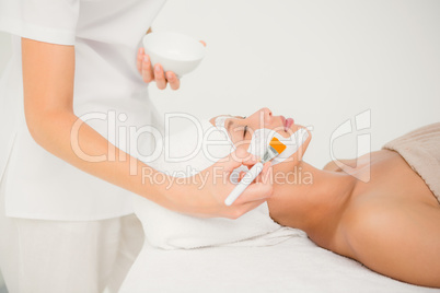 Attractive woman receiving treatment at spa center