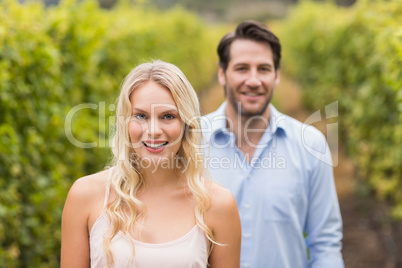 Young happy couple smiling at camera