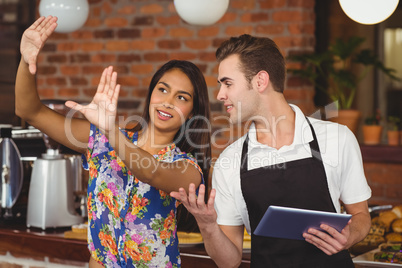 Pretty customer explaining to waiter