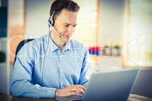 Casual businessman using headset on a call