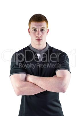 Rugby player with arms crossed