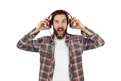 Handsome hipster enjoying listening to music