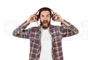 Handsome hipster enjoying listening to music