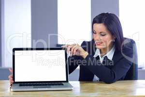 Businesswoman showing her laptop screen