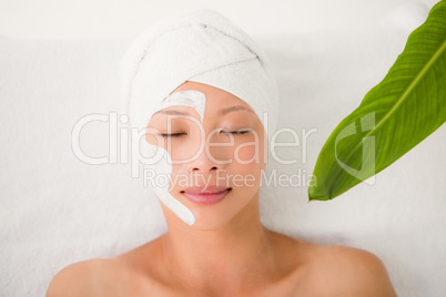 Attractive woman with cream treatment